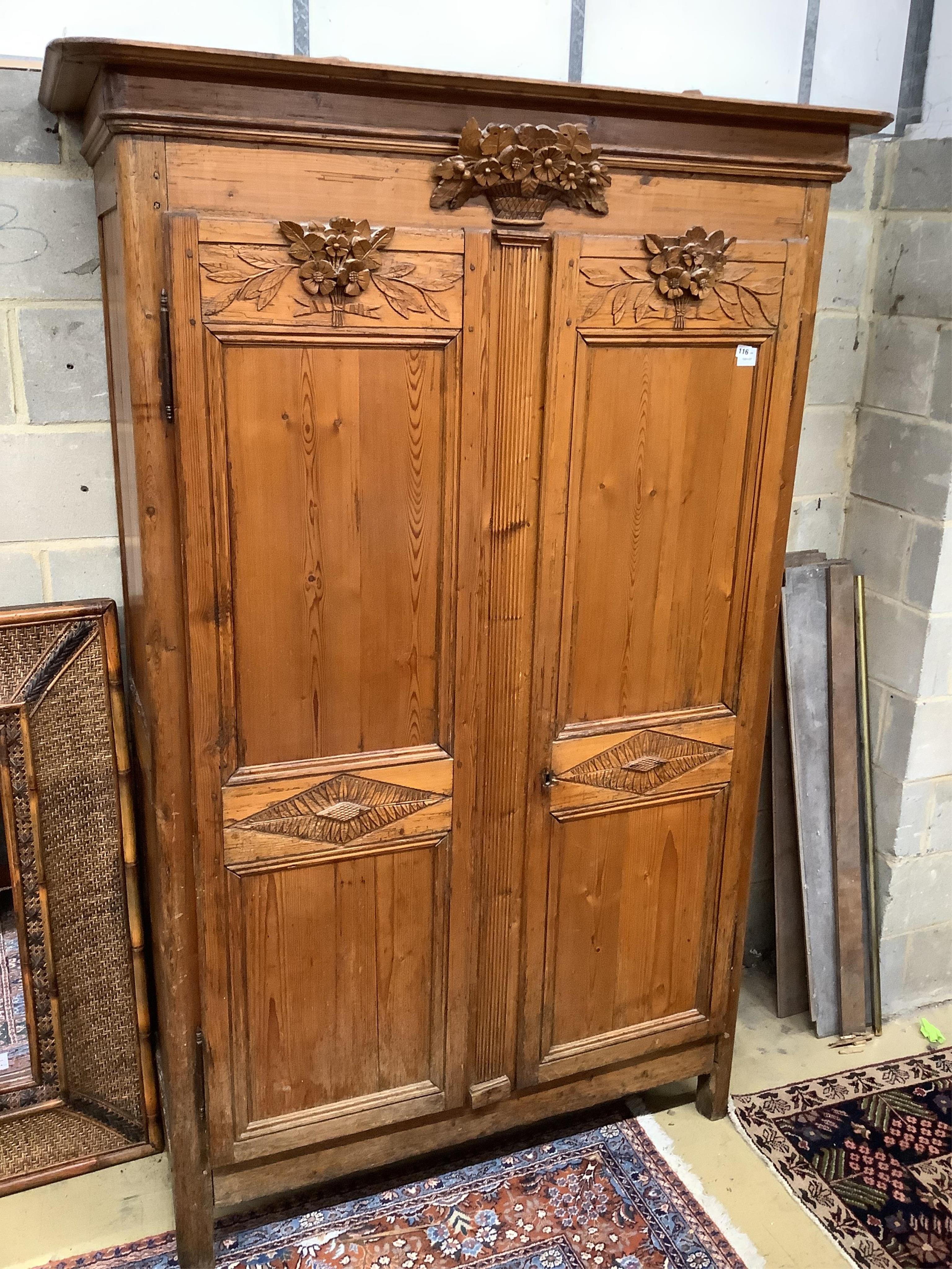 A 19th century French carved pine armoire, width 146cm, depth 58cm, height 218cm. Condition - fair